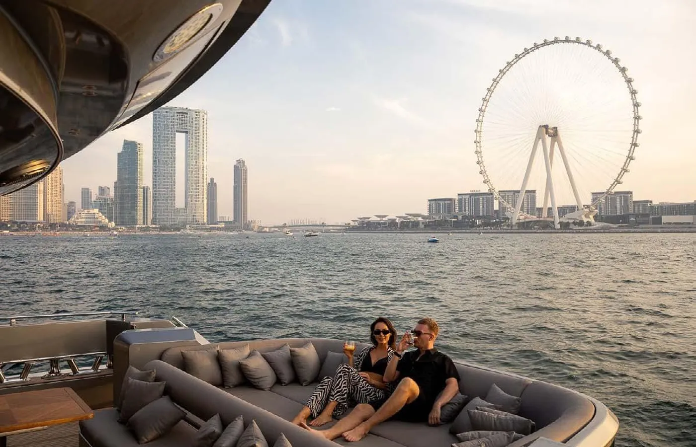 Luxury yacht in Dubai: guests on deck by Ain Dubai